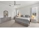 Spacious main bedroom with carpet flooring, ample natural light and ensuite bathroom at 642 Boundary Blvd, Rotonda West, FL 33947