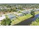 Charming neighborhood featuring waterfront homes with private pools and beautifully landscaped yards at 68 Long Meadow Ln, Rotonda West, FL 33947