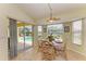 Bright dining area with sliders to the pool area, letting light stream in at 68 Long Meadow Ln, Rotonda West, FL 33947