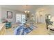 Bright dining room with neutral walls, dining table with chairs, and large window at 68 Long Meadow Ln, Rotonda West, FL 33947
