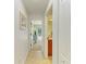 Hallway with tile flooring offering a view of the Primary bedroom at 68 Long Meadow Ln, Rotonda West, FL 33947