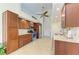 Modern kitchen with wood cabinets, stainless steel appliances, and granite countertops at 68 Long Meadow Ln, Rotonda West, FL 33947