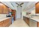 Spacious kitchen boasts granite countertops, stainless steel appliances, and ample cabinet space at 68 Long Meadow Ln, Rotonda West, FL 33947