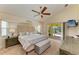 Spacious main bedroom with a tray ceiling, ceiling fan and plenty of natural light at 68 Long Meadow Ln, Rotonda West, FL 33947
