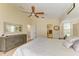 A beautifully designed main bedroom with an en-suite and walk-in closet entrance at 68 Long Meadow Ln, Rotonda West, FL 33947