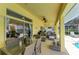 Inviting outdoor living space with ample seating, perfect for relaxing and entertaining overlooking the pool at 68 Long Meadow Ln, Rotonda West, FL 33947
