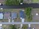 Bird's eye view of neighborhood with tidy landscaping, houses, and canal at 725 Clearview Dr, Port Charlotte, FL 33953