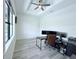 Spacious bedroom features tray ceiling, large windows, and modern ceiling fan at 725 Clearview Dr, Port Charlotte, FL 33953