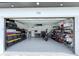 Spacious garage with organized storage, epoxy flooring, and ample room for vehicles at 725 Clearview Dr, Port Charlotte, FL 33953