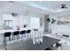 Open kitchen design with counter seating and stainless appliances at 725 Clearview Dr, Port Charlotte, FL 33953
