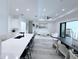 Contemporary interior featuring open kitchen with stainless steel appliances and barstool seating at 725 Clearview Dr, Port Charlotte, FL 33953