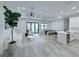 Spacious open floorplan connecting the living room, dining area, and modern kitchen at 725 Clearview Dr, Port Charlotte, FL 33953