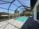Inviting screened-in pool and spa area offering canal views, ideal for outdoor enjoyment at 725 Clearview Dr, Port Charlotte, FL 33953