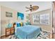 Bright bedroom features a comfortable bed, colorful decor, and plenty of natural light at 7470 Palm Island Dr # 2813, Placida, FL 33946