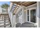 Charming entrance with stairs leading to a welcoming door with visible unit number at 7470 Palm Island Dr # 2813, Placida, FL 33946