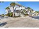 Condo exterior highlighting the architecture and a lush, tropical landscape at 7470 Palm Island Dr # 2813, Placida, FL 33946