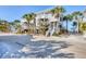 Beautifully landscaped condo featuring stairs leading up to private balconies overlooking lush greenery at 7470 Palm Island Dr # 2813, Placida, FL 33946