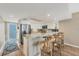 Bright kitchen featuring stainless steel appliances, granite countertops, and a breakfast bar with seating at 7470 Palm Island Dr # 2813, Placida, FL 33946
