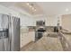 Well-equipped kitchen boasts stainless steel appliances, mosaic backsplash, and ample counter space at 7470 Palm Island Dr # 2813, Placida, FL 33946