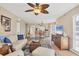 Open-concept living room with dining area, and kitchen beyond; hardwood floors, coastal decor and furniture at 7470 Palm Island Dr # 2813, Placida, FL 33946