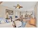 Comfortable living room with a sofa, lounge chair, ottoman, side tables, rug, and ceiling fan at 7470 Palm Island Dr # 2813, Placida, FL 33946