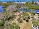 Expansive aerial view of lush land with palm trees surrounded by tranquil waterways at 760 S Oxford Dr, Englewood, FL 34223