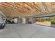 Spacious unfinished basement with open garage door leading to the outdoors is ready for customization at 760 S Oxford Dr, Englewood, FL 34223