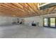 Unfinished basement with concrete floor, exposed wood ceiling, and block walls offers potential for customization at 760 S Oxford Dr, Englewood, FL 34223