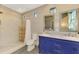 Bathroom featuring double sinks, decorative mirrors, and modern fixtures, offering a stylish and functional space at 760 S Oxford Dr, Englewood, FL 34223