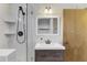 Bathroom with modern vanity, glass shower, and stylish fixtures at 760 S Oxford Dr, Englewood, FL 34223