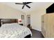 Cozy bedroom featuring a bed, side table with lamp, and a view into the closet at 760 S Oxford Dr, Englewood, FL 34223