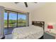 Bedroom featuring balcony access, a ceiling fan, and neutral decor at 760 S Oxford Dr, Englewood, FL 34223