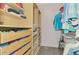 Spacious walk-in closet with custom shelving and storage solutions, designed for organization and convenience at 760 S Oxford Dr, Englewood, FL 34223