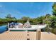 Boat docked on a private wooden pier with views of lush mangrove and surrounding water at 760 S Oxford Dr, Englewood, FL 34223