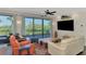 Bright living room featuring comfortable seating, large windows and scenic outdoor views at 760 S Oxford Dr, Englewood, FL 34223