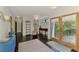 Spacious living room with dark floors and access to the outdoors through elegant glass doors at 760 S Oxford Dr, Englewood, FL 34223
