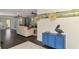 Open-concept living area with waterfront view, hardwood flooring, and coastal decorations at 760 S Oxford Dr, Englewood, FL 34223
