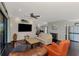 Bright and airy living room featuring shiplap walls, modern furnishings, and open layout at 760 S Oxford Dr, Englewood, FL 34223