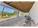 Covered patio featuring stone groundcover, perfect for outdoor relaxation, offers ample space and charm at 760 S Oxford Dr, Englewood, FL 34223