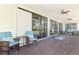 Expansive screened porch with comfortable seating, scenic water views, and ceiling fans for relaxing outdoor living at 760 S Oxford Dr, Englewood, FL 34223