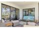 Screened porch with comfortable seating, scenic water views, and access to the interior through sliding glass doors at 760 S Oxford Dr, Englewood, FL 34223