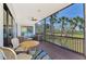Spacious screened porch featuring scenic water views and comfortable seating for enjoying outdoor living at 760 S Oxford Dr, Englewood, FL 34223