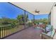 Spacious screened porch boasts comfortable seating and a scenic waterfront view at 760 S Oxford Dr, Englewood, FL 34223