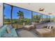 Relax on this spacious screened porch with comfortable seating and panoramic water views at 760 S Oxford Dr, Englewood, FL 34223