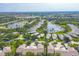 The aerial view showcases the community's well-maintained lakes and single-Gathering homes at 821 Montrose Dr # 201, Venice, FL 34293