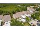 Wide aerial view of residential neighborhood with mature trees and well-kept townhomes at 821 Montrose Dr # 201, Venice, FL 34293