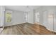 Bedroom featuring wood flooring, large windows, and ceiling fan with an ensuite bathroom at 821 Montrose Dr # 201, Venice, FL 34293