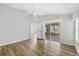 Bedroom with wood flooring, ceiling fan, and sliding glass doors to an outdoor patio space at 821 Montrose Dr # 201, Venice, FL 34293