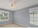 Bedroom featuring a neutral color palette, carpeted floor, and windows with blinds at 821 Montrose Dr # 201, Venice, FL 34293