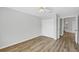 Bedroom features hardwood floors, closet, and neutral wall paint at 821 Montrose Dr # 201, Venice, FL 34293